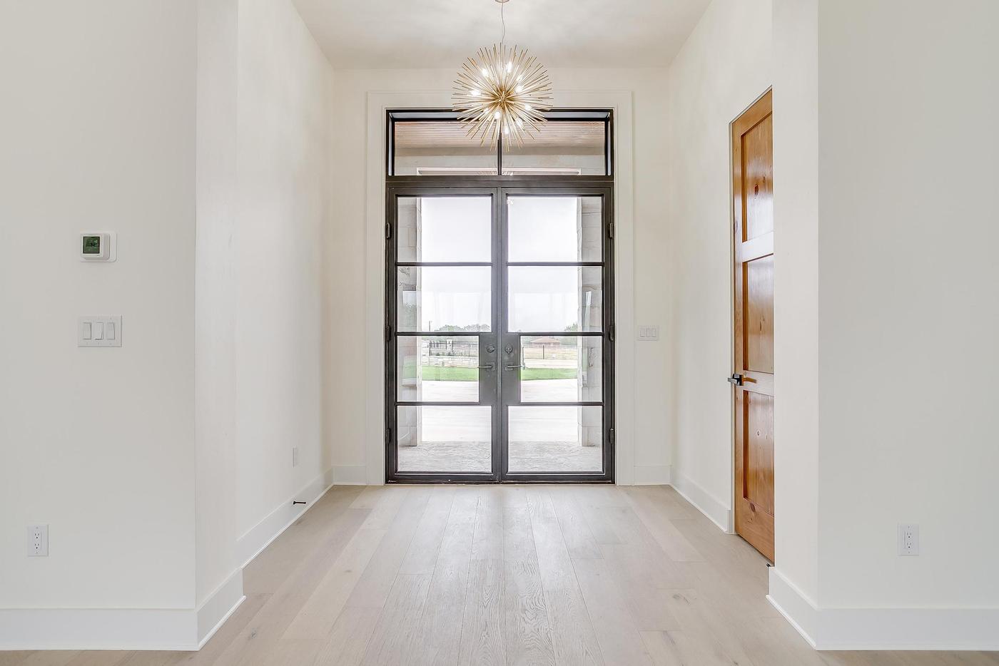 Completed luxury custom home front entrance Texas